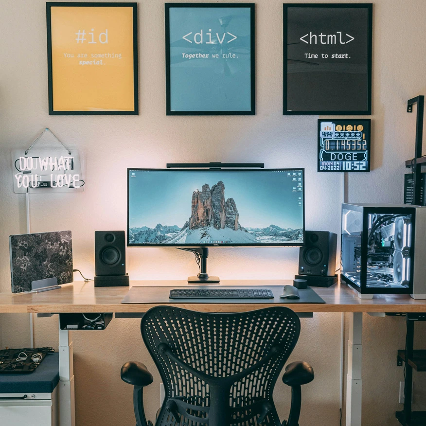 Web design and development workspace with computer and monitor